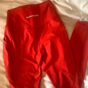 Alphalete surface pocket red leggings